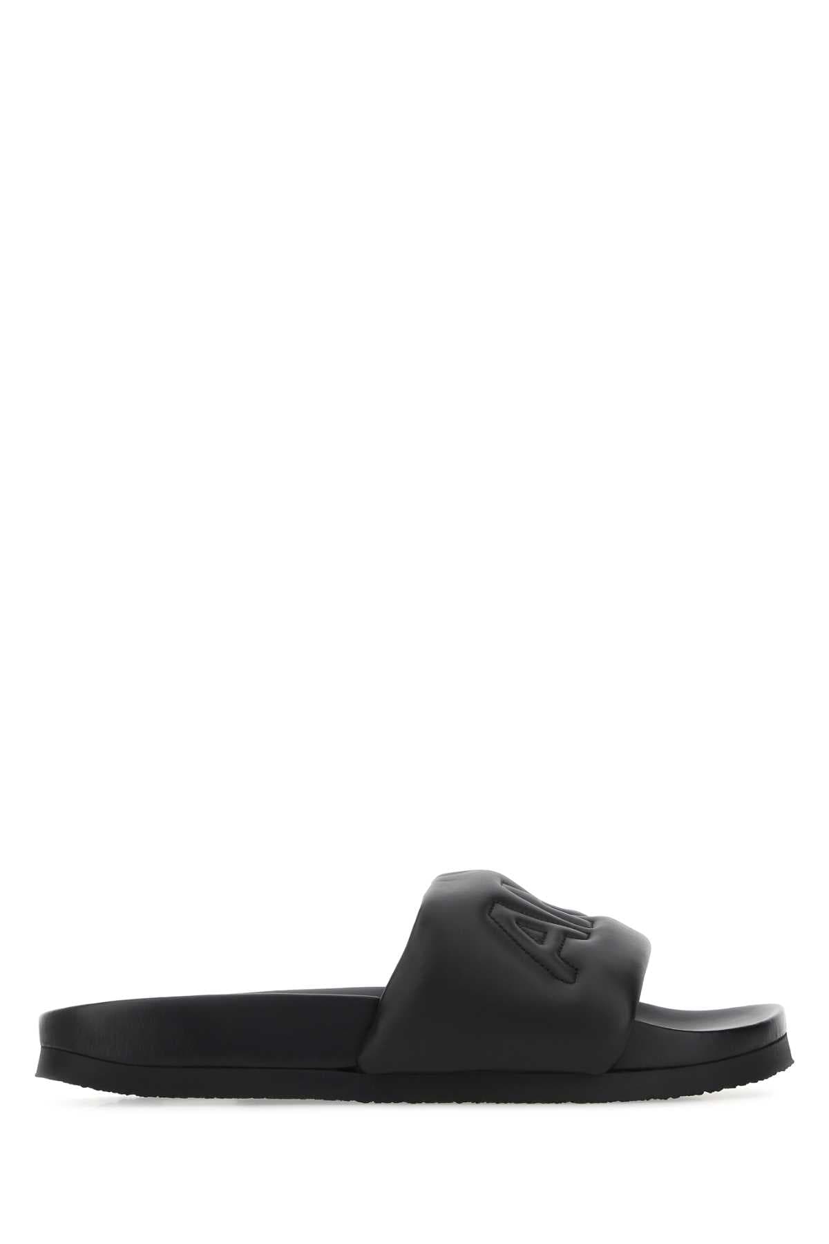 Black leather slippers