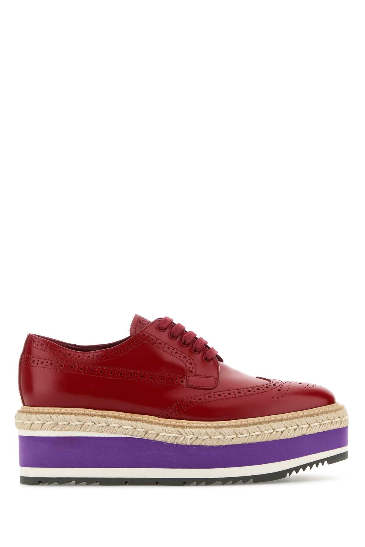 Red leather lace-up shoes