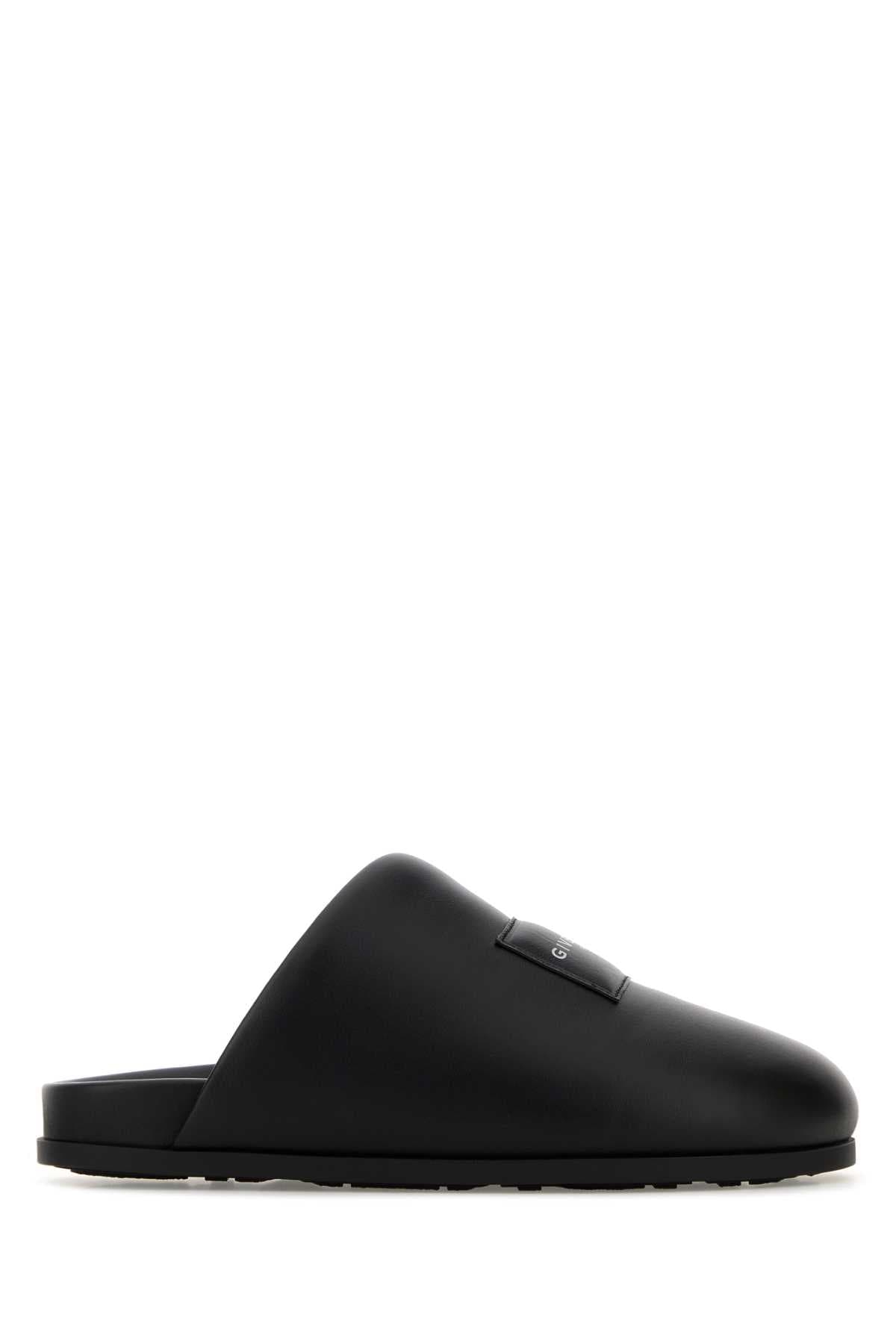Black leather slippers