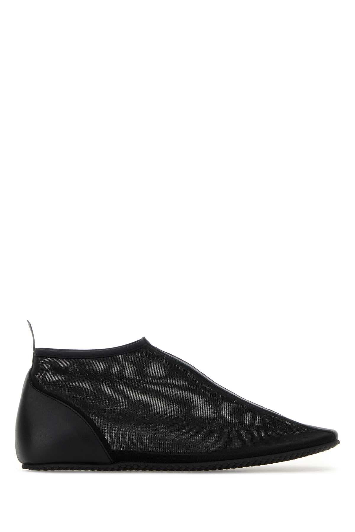 Black mesh slip ons
