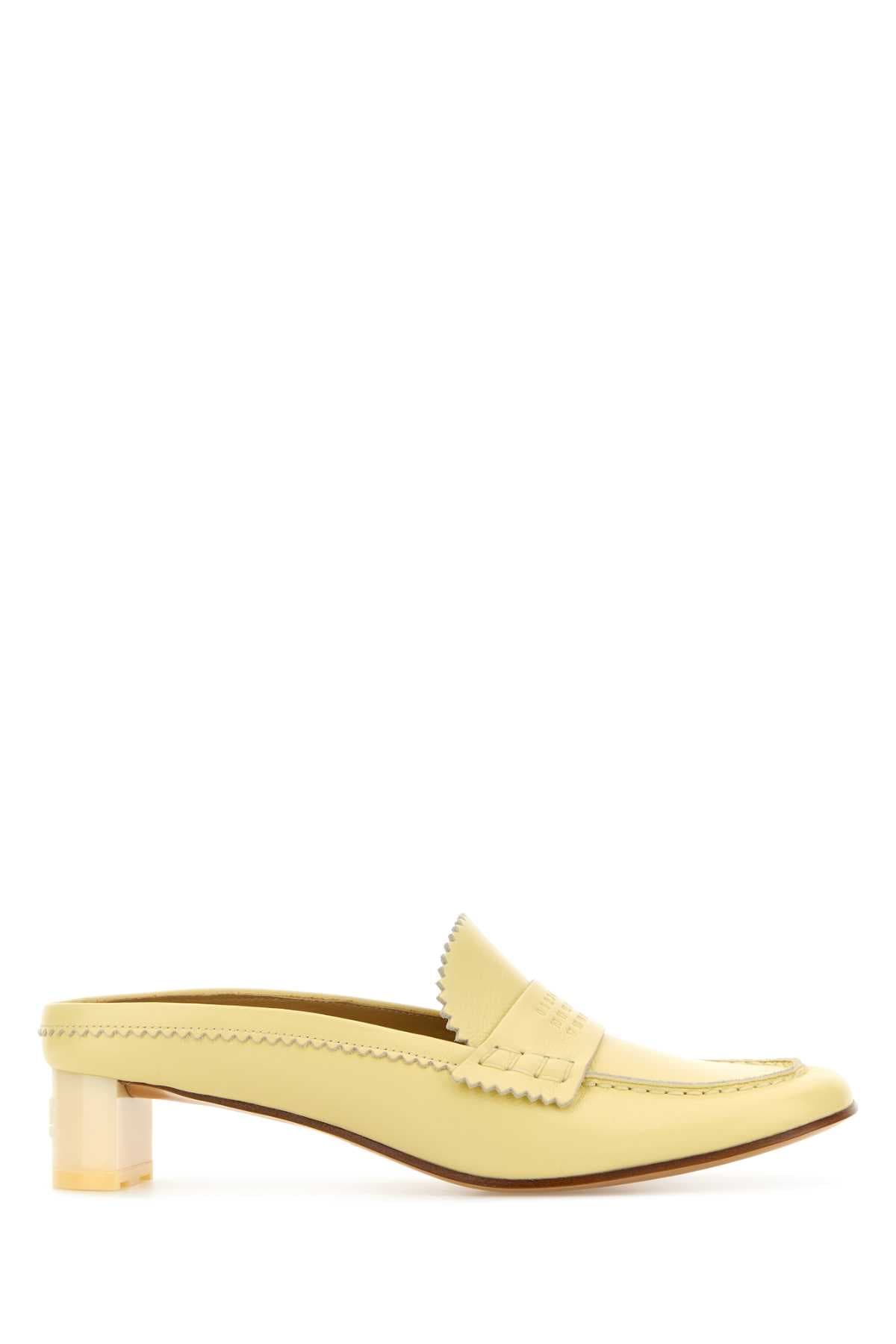 Pastel yellow leather mules