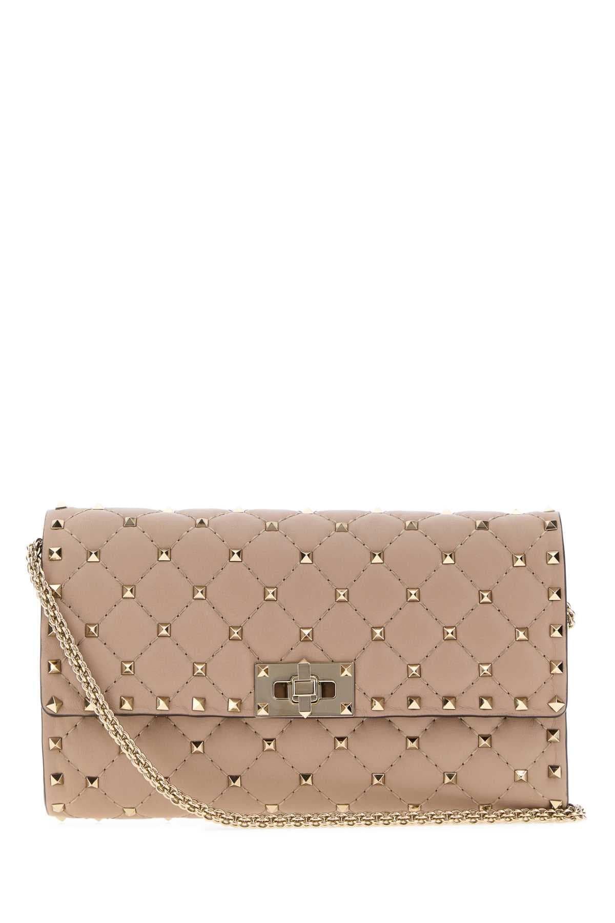Antiqued pink nappa leather Rockstud Spike clutch
