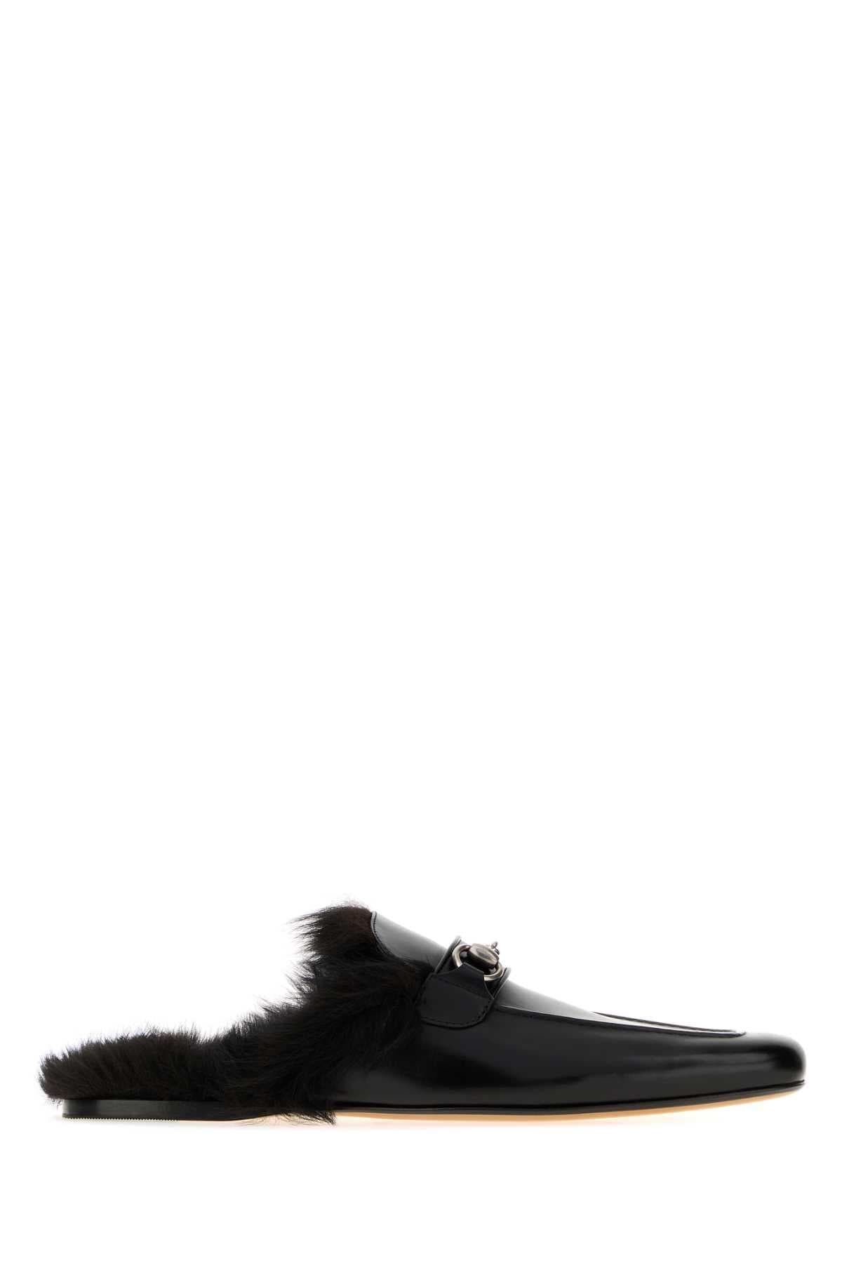 Black leather slippers